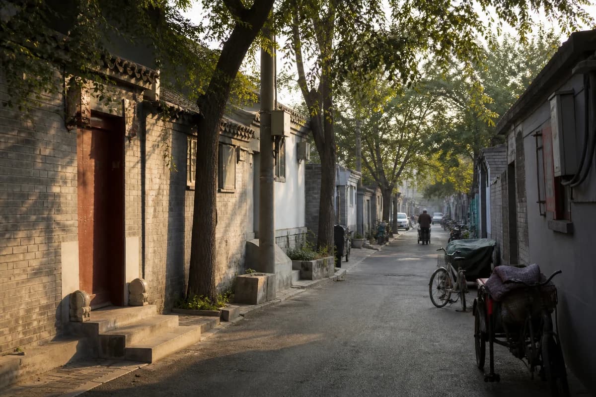 A lived-in Beijing hutong in warm morning light