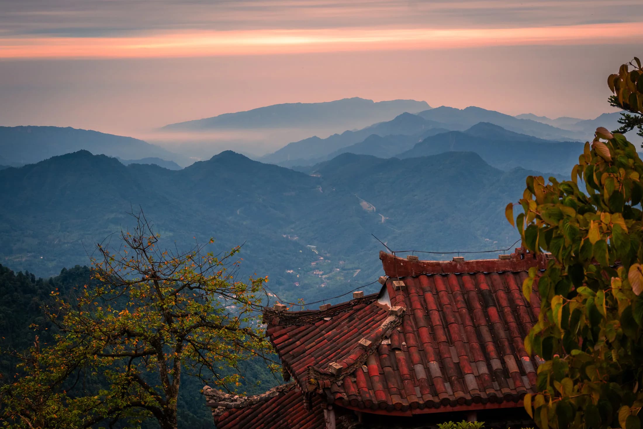 Layered Wudang mountain ridges at sunset